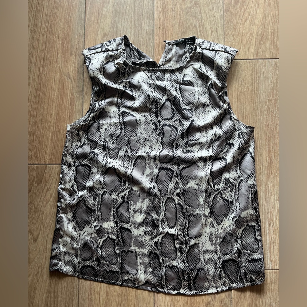 Black and grey snakeskin sleeveless blouse with shoulder pads